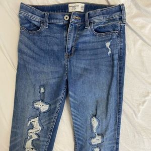 Abercombrie Kids skinny medium wash jeans.